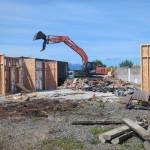 Workers with Hoch Construction remove much of the structure at the Sequim Library location, 630 N. Sequim Ave., in preparation for the major expansion project. (Noah Glaude/North Olympic Library System)
