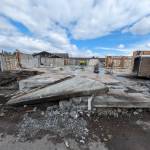 Workers with Hoch Construction remove much of the structure at the Sequim Library location, 630 N. Sequim Ave., in preparation for the major expansion project. (Noah Glaude/North Olympic Library System)