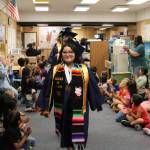 Forks High School graduates walk the halls of Quillayute Valley School District schools June 7 before graduation the following day. They started at Forks Elementary and continued on to the other buildings, then boarded a school bus and rode through town, culminating in a walk through Forks Outfitters. (Christi Baron/Olympic Peninsula News Group)