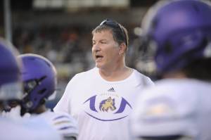 Michael Dashiell/Olympic Peninsula News Group
Sequim head coach Erik Wiker gives instruction to players in a non-league game at Spartan Stadium in Forks in September 2023.