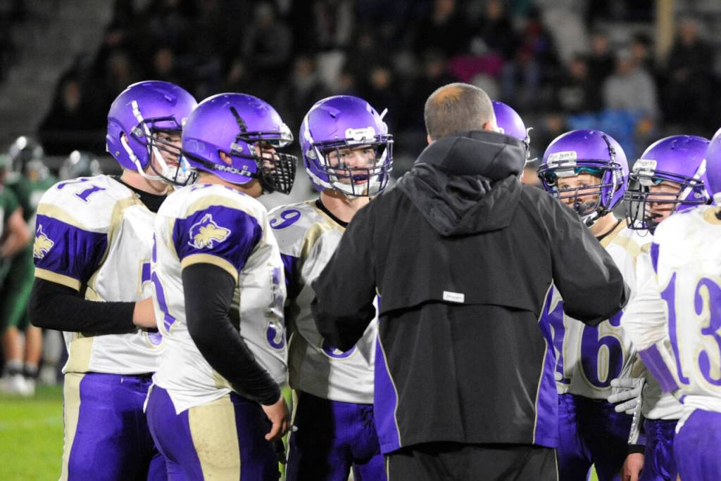Sequim Gazette file photo by Michael Dashiell / Sequim players listen as head coach Erik Wiker gives instruction in a 2017 game against Port Angeles.