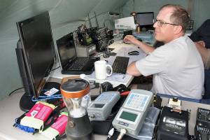 Matt Larson of Sequim, who uses the radio call sign KC7EQO, tunes into a ham radio satellite during Saturdays Radio Field Day at the Clallam County Fairgrounds in Port Angeles. The annual event, hosted by the Clallam County Amateur Radio Club, brought together amateur radio operators from around the world in a contest to make as many radio contacts as possible in a 24-hour period as a test of emergency preparedness from remote locations. (Keith Thorpe/Peninsula Daily News)