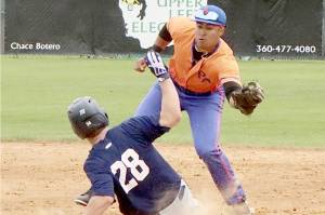 Lefties shortstop Roberto Garza-Nunez gets the tag down in time to get the Kelowna runner out on his attempted steal at Civic Field on Sunday. (Dave Logan/for Peninsula Daily News)