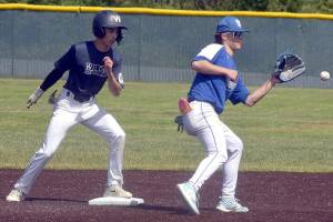 KEITH THORPE/PENINSULA DAILY NEWS
Wilder Junior's Bryce DeLeon, left, arrives at second ahead of the throw to Sedro-Woolley shortstop Cail Wilson on Tuesday afternoon at Port Angeles Volunteer Field.