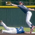 KEITH THORPE/PENINSULA DAILY NEWS Wilder Junior first baseman Ryland Prioette, right, tries to catch Sedro-Woolleys Kevin Macagba off the bag on Tuesday at Volunteer Field in Port Angeles.