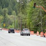 A temporary traffic light to control one-way traffic alternationacross the current U.S. 101 bridge over the Elwha River southwest of Port Angeles awaits activation on Wednesday in preparation for moving traffic to a new nearby Elwha bridge. (KEITH THORPE/PENINSULA DAILY NEWS)