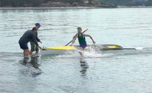 Cooper Disque of the Olympic Peninsula Rowing Association leaves his boat in the Western Canadian Beach Sprint Championship held last weekend. (Olympic Peninsula Rowing Association)