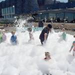 Children cavort in a sea of foam as a childrens activity on Independence Day at Port Angeles City Pier. (Keith Thorpe/Peninsula Daily News)