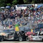 There was a lot of smoke and flames during the Forks Fourth of July celebration at the Tillicum Park Arena as a large crowd gathered to watch their favorite demolition cars in action. (Lonnie Archibald/for Peninsula Daily News)