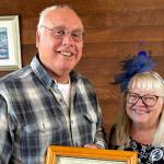 Dan Peacock, on left, receives the 2024 Community Service Award from Lora Brabant, president of the Clallam County School Retirees Association.