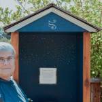Diane Fatzinger stands near her wind phone located across from the Sequim School District soccer fields on the Olympic Discovery Trail. (Elijah Sussman/Olympic Peninsula News Group)