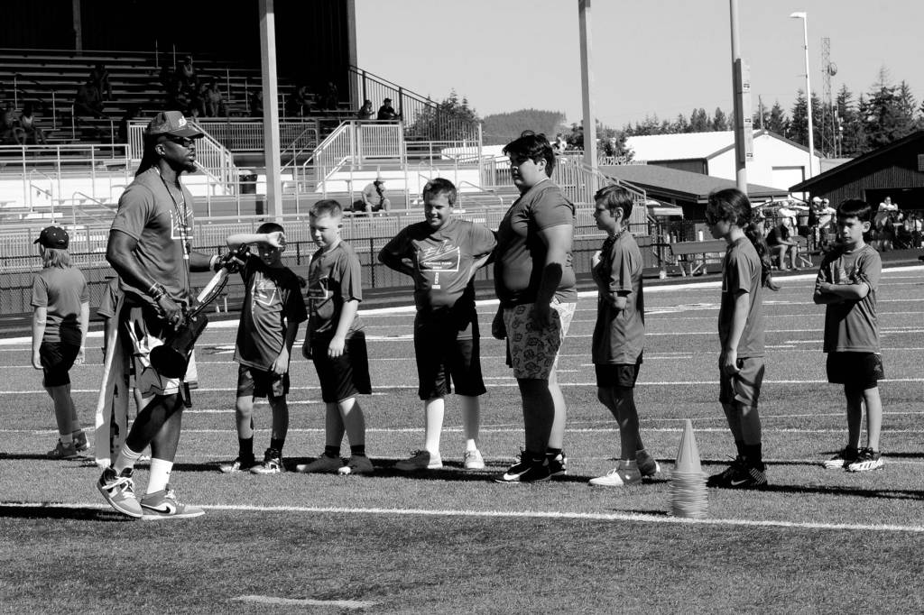 Lonnie Archibald/for Peninsula Daily News
Former Seattle Seahawks special teams captain and current coach Neiko Thorpe instructs athletes during a football camp held recently at Spartan Stadium. Some 68 participants from Forks, Neah Bay, Hoquiam and Montesano turned out for the camp. Thorpe is married to Forks native Maegan Leppell.
