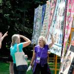 Bernadette Shein helps answer quilt questions for visitors of the Sunbonnet Sue Quilt Clubs annual quilt show in 2023. This year, the event will move to Trinity United Methodist Church and expand to two days, Friday and Saturday. (Matthew Nash/Olympic Peninsula News Group)