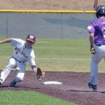 KEITH THORPE/PENINSULA DAILY NEWS Wilder Junior shortstop Bryce DeLeon takes the throw from home to cut off a steal attempt by Pipeline Pirate AAA baserunner Matt Noa on Saturday at Volunteer Field in Port Angeles.