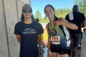 Photo by Kirsti Turella / Clare Turella celebrates with high jump coach Ten Gordon after Turella won the Region 13 high jump championship in Gresham, Oregon, earlier this month. Turella, who will be a sophomore at Sequim High this fall, earned a spot in the Junior Olympic Championships in August.