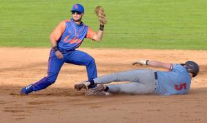 KEITH THORPE/PENINSULA DAILY NEWS
Lefties shortstop Yahir Ramirez, left, tags out a Wenatchee player at a game in June at Civic Field. Ramirez hit a double and drove in two runs in a 15-6 win Thursday night over Redmond.