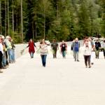 Lower Elwha Klallam Tribal Chairwoman Francis Charles leads tribal members in a ceremony across the length of the new Elwha River bridge, which opened Sunday afternoon. The tribal members dedicated the surface with cedar bows as members of the bridge crew watched from left. (Dave Logan/for Peninsula Daily News)