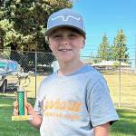 At the end of the Clallam County prefair show, Wes Church received the Biggest Helping Hand Award for helping to keep the barn clean, running errand and giving encouraging compliments. (Photo by Katie Newton)