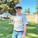 At the end of the Clallam County prefair show, Wes Church received the Biggest Helping Hand Award for helping to keep the barn clean, running errand and giving encouraging compliments. (Photo by Katie Newton)