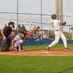 Wilder Senior's Braydan White crushes an RBI double in the first inning against Gonzaga Prep on Saturday night at Civic Field in Wilder's opening game of the AAA American Legion state tournament. (Pierre LaBossiere/Peninsula Daily News)