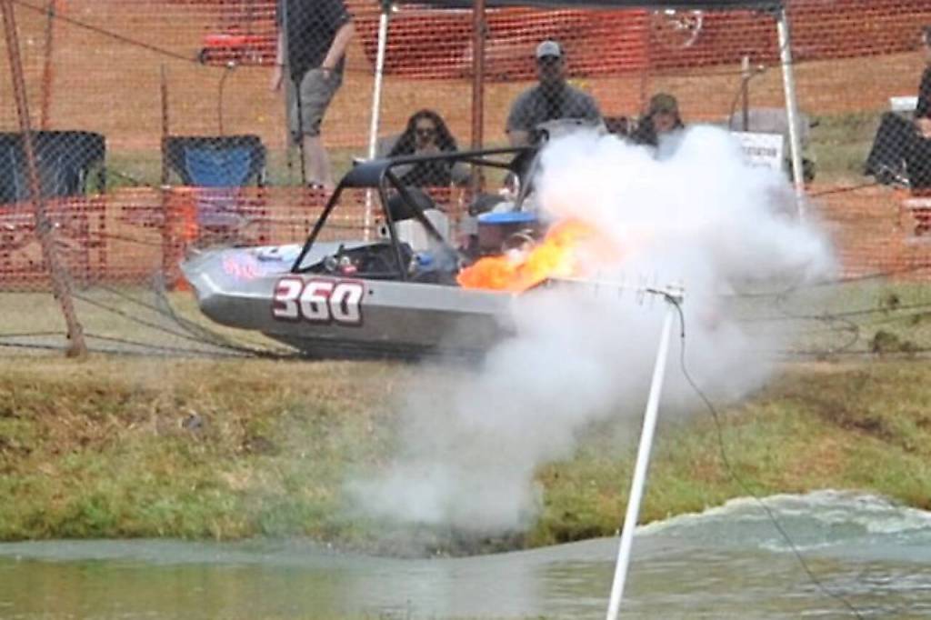 The Jolly Rogers 360 engine bursts into flames after a crash during qualifying Saturday. The fire was quickly put out as driver and navigator got out of the boat. (Lonnie Archibald/for Peninsula Daily News)