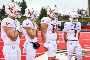 Courtesy Eastern Washington Athletics
Forks' Luke Dahlgren, second from right, shown during a pregame coin flip during the 2023 season, has been selected as a captain for the second straight season for the Eastern Washington football team.