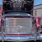 A 1956 Bel Air Nomad attracts passersby with its reflective chrome at the Sequim Prairie Nights Car Show last year. The pattern on the underside of the hood is the reflection of the engine, a Corvette 546 HP. (Emily Matthiessen/Olympic Peninsula News Group)