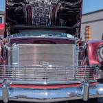A 1956 Bel Air Nomad attracts passersby with its reflective chrome at the Sequim Prairie Nights Car Show last year. The pattern on the underside of the hood is the reflection of the engine, a Corvette 546 HP. (Emily Matthiessen/Olympic Peninsula News Group)