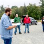Port of Port Townsend Harbor Master Kristian Ferraro reads the protocol for bidding to interested parties attending the auction of the historic tug Elmore on Monday. The auction produced no bidders at the opening bid of $10,000. (Steve Mullensky/for Peninsula Daily News)
