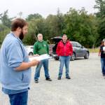 Port of Port Townsend Harbor Master Kristian Ferraro reads the protocol for bidding to interested parties attending the auction of the historic tug Elmore on Monday. The auction produced no bidders at the opening bid of $10,000. (Steve Mullensky/for Peninsula Daily News)