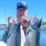 Yakima angler Terry Day brought home these two hatchery coho Sunday while fishing in the waters of Marine Area 4 (Neah Bay).