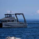 The state Department of Ecologys first hybrid research vessel, Resilience, cruises by Sequim Bay on its way to dock at the John Wayne Marina in mid-July. The vessel will operate out of the marina for a few months while PNNL-Sequim is updating its dock. (Eric Francavilla/Pacific Northwest National Laboratory)