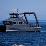 The state Department of Ecologys first hybrid research vessel, Resilience, cruises by Sequim Bay on its way to dock at the John Wayne Marina in mid-July. The vessel will operate out of the marina for a few months while PNNL-Sequim is updating its dock. (Eric Francavilla/Pacific Northwest National Laboratory)