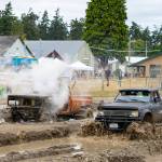 James Baker of Longview stalls out his nitrous oxide charged 76 Blazer in a race against Ethan Newman of Quilcene in his Chevy 350-powered 1980 Toyota pickup during the mud drags at the Jefferson County Fairgrounds on Sunday. (Steve Mullensky/for Peninsula Daily News)