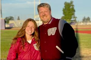 Sequims Riley Pyeatt with her high school coach Brad Moore at Sequims new track surface earlier this month. Pyeatt just signed a scholarship to run track and field for Washington State as both her and Moore are now proud Cougars. (Tracie Pyeatt)