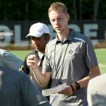 Head mens soccer coach Jake Hughes talks with his team during a practice at Wally Sigmar Field last week. The Pirates men and women are both ranked No. 1 in a preseason coaches poll. (Peninsula College)