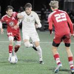 KEITH THORPE/PENINSULA DAILY NEWS
Peninsula's Nil Grau, center, fights off Skagit Valley's Fernando Velazquez at Peninsula College's Wally Sigmar Field last season. Grau, who scored eight goals last year for the Pirates, returns for his sophomore season this year.