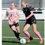 Peninsulas Anna Petty, right, advances the ball past Whatcoms Tori Oord during a match last year at Wally Sigmar Field in Port Angeles. Petty, who scored 12 goals last year, is back for the Pirates this season. (Keith Thorpe/Peninsula Daily News)