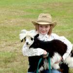 Marella Coff, a member of the Lambchops 4H Club, poses with her goat Danny Boy at the Clallam County Fair on Friday. (Dave Logan/For Peninsula Daily News)