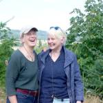 Sarah Spaeth, left, and Kate Godman stand at a viewpoint on the north side of the newly acquired Chimacum Ridge Community Forest. (Elijah Sussman/Peninsula Daily News)
