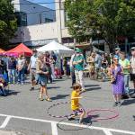 Frankie Adamson, 6, of Port Townsend swings his hips to the tunes of local band Intensive Porpoises during the 32nd Port Townsend Uptown Street Fair on Saturday. (Steve Mullensky/for Peninsula Daily News)