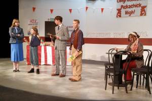 Principal Bonnie Bird (Aubrey Tanner) talks to Captain Curry (Matilda Redlin) and Rich Gravee (Henry Wendel) about the International Chicken Cooking Contest while reporters Burgundy Divan (Isaac Wendel) and Carla (Alivia Halverson) try to solve the murder of a famous chef in the Port Angeles Community Players Childrens Theater production of Murder Most Fowl this weekend. (Port Angeles Community Players)