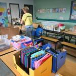 Kim Rosales and other volunteers help gather school supplies for students at last years Back to School Fair at the Sequim Boys & Girls Club. (Michael Dashiell/Olympic Peninsula News Group)