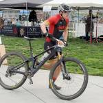 Calvin Colander of Bellingham-based Team Improbability Drive heads for the handoff after finishing the mountain bike leg of the 2023 Big Hurt in Port Angeles. (Keith Thorpe/Peninsula Daily News)