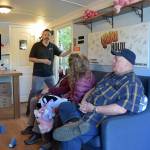 Tom Waertz of Ready America, left, runs an earthquake simulation in a shake trailer as participants, from left, Sequim EMT Lisa Law, CERT member Anne Koepp of Joyce and Jim Buck of the Joyce Emergency Planning and Preparation Group recover after being jolted by a 6.8-magnitude quake. (Keith Thorpe/Peninsula Daily News)