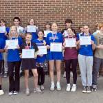 Nearly two dozen Port Townsend High School and Blue Heron Middle School students wrapped a summer of five-times-a-week weight training and beach conditioning sessions with five-time national bench press champion Brooks Kubik. From left, Kaleb Kruse, Asher Little, Silas Morford, Luke Ohara, Layton Lopeman, Django Lynge, Bryce Harbin, Grady White, Rylen Kruse, Levi Donahue, Manaseh Lanphear Ramirez. Front row from left to right: Victor Paz, Carlos Diaz, Grace Ayer, Maddie Vanags, Mi Amada Lanphear Ramirez, Ursula Schmidt, Zinnia Blatchley, Natalie Hollow-Bist, Finn Evans and Robin Evans. Not pictured: Simon Klontz and Jonah Temple.