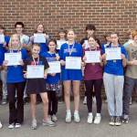 Nearly two dozen Port Townsend High School and Blue Heron Middle School students wrapped a summer of five-times-a-week weight training and beach conditioning sessions with five-time national bench press champion Brooks Kubik. From left, Kaleb Kruse, Asher Little, Silas Morford, Luke O'hara, Layton Lopeman, Django Lynge, Bryce Harbin, Grady White, Rylen Kruse, Levi Donahue, Manaseh Lanphear Ramirez. Front row from left to right: Victor Paz, Carlos Diaz, Grace Ayer, Maddie Vanags, Mi Amada Lanphear Ramirez, Ursula Schmidt, Zinnia Blatchley, Natalie Hollow-Bist, Finn Evans and Robin Evans. Not pictured: Simon Klontz and Jonah Temple.