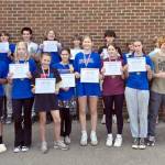 Nearly two dozen Port Townsend High School and Blue Heron Middle School students wrapped a summer of five-times-a-week weight training and beach conditioning sessions with five-time national bench press champion Brooks Kubik. From left, Kaleb Kruse, Asher Little, Silas Morford, Luke Ohara, Layton Lopeman, Django Lynge, Bryce Harbin, Grady White, Rylen Kruse, Levi Donahue, Manaseh Lanphear Ramirez. Front row from left to right: Victor Paz, Carlos Diaz, Grace Ayer, Maddie Vanags, Mi Amada Lanphear Ramirez, Ursula Schmidt, Zinnia Blatchley, Natalie Hollow-Bist, Finn Evans and Robin Evans. Not pictured: Simon Klontz and Jonah Temple.