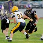 Michael Dashiell/Olympic Peninsula News Group
Sequims quarterback Zeke Schmadeke runs with the ball against Forks. In on the play is the Spartans Landon Thomas (34).
