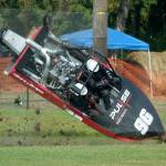 The Stars and Stripes Boat No. 96 driving by Burt Roberts and navigated by Luke Stewart, crashes out during the finals of the American Sprint Boat Racing quarterfinals Sunday at the Extreme Sports Park in Port Angeles. (Jeff Halstead/for Peninsula Daily News)
